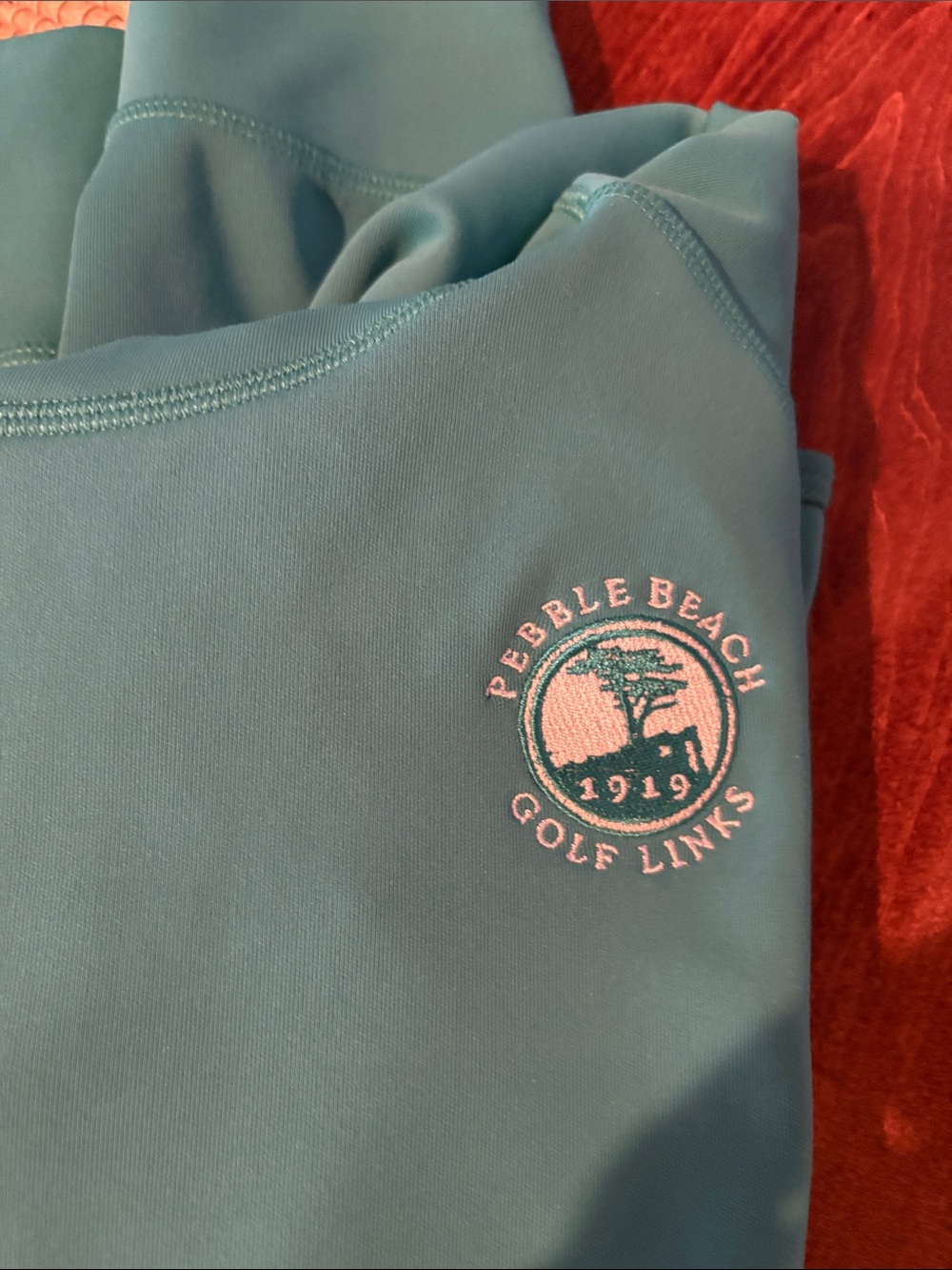 Pebble Beach Teal One-Piece pull over  with white Logo Embroidery